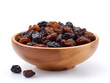 raisins in a wooden bowl  isolated on white background 
