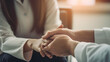 © Prasanth - Close-up of psychiatrist hands together holding palm of her patient. comforts an anxious depression patient for medical treatment in diagnostic room, PTSD Mental health concept
