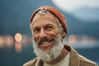 © insta_photos - Happy older bearded man standing in nature park outdoors and laughing. Smiling active mature senior traveler looking at camera advertising camping tourism. Close up face front portrait.