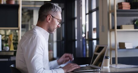 Wall Mural - CEO, laptop and a man to start work at a desk in his corporate or professional office for an email. Computer, paperwork and typing a report with male employee working on remote company project