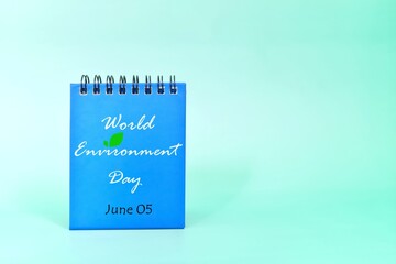 Wall Mural - June 5 as World Environment Day date reminder on blue desk calendar. Celebration concept.	