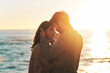 © Emil Lime/peopleimages.com - Sunset, beach and couple touching face for relaxing, bonding and quality time on romantic date. Nature, love and man and woman embrace for anniversary or honeymoon on holiday, weekend and vacation