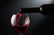 canvas print picture - Pouring red wine into a wine glass.