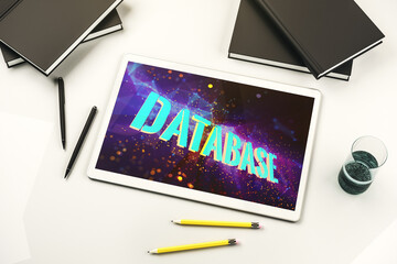 Poster - Top view of modern digital tablet monitor with Database word sign, global research and analytics concept. 3D Rendering
