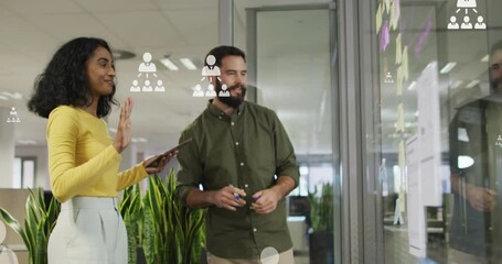 Poster - Animation of profile icons floating over diverse man and woman discussing over memo notes at office