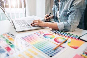 Poster - Young creative graphic designer working on color selection and d
