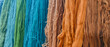 multicolor wool yarns for carpets hang on the wall