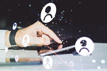 Poster - Double exposure of social network icons concept and hand working with a digital tablet on background. Networking concept