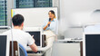 © metamorworks - Female teacher teaching in class room. Business seminar.