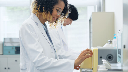 Poster - Group of researcher using experimental equipment.