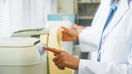 Poster - Group of researcher using experimental equipment.