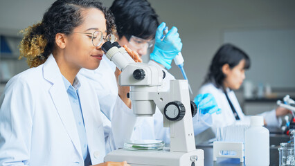 Aufkleber - Multinational researcher group experimenting in the lab.