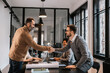 © Dusan Petkovic - The businesspeople are shaking hands in boardroom.