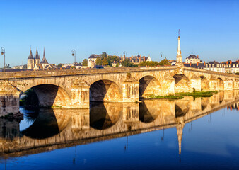 Old bridge in Blois, France, Europe. Scenery of vintage stone structure over Loire River