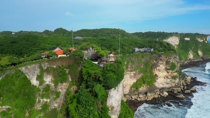 Wall Mural - Aerial shot of Uluwatu temple. Uluwatu Temple is a Balinese Hindu sea temple located in Uluwatu.