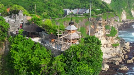 Wall Mural - Aerial shot of Uluwatu temple. Uluwatu Temple is a Balinese Hindu sea temple located in Uluwatu.