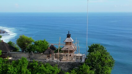 Wall Mural - Aerial shot of Uluwatu temple. Uluwatu Temple is a Balinese Hindu sea temple located in Uluwatu.