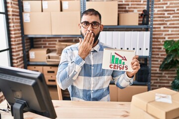 Sticker - Middle east man with beard working at small business ecommerce holding crisis banner covering mouth with hand, shocked and afraid for mistake. surprised expression