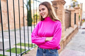 Sticker - Young woman smiling confident standing with arms crossed gesture at street