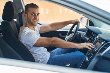 Sticker - Young caucasian man sitting on car turning on radio at street