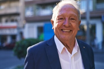 Poster - Middle age grey-haired man smiling confident standing at street