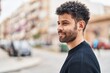 © Krakenimages.com - Young arab man smiling confident standing at street