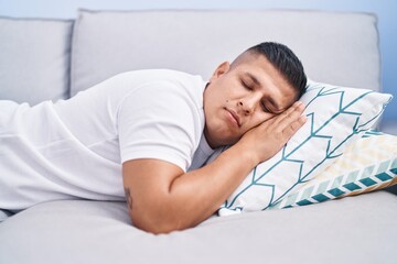 Poster - Young latin man lying on sofa sleeping at home