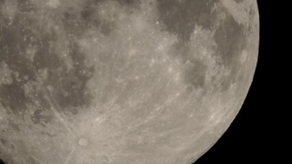 Wall Mural - Full moon moves slow at night sky. Sharp footage of full moon with telephoto lens close-up. Moon shot from ground. Moon witchcraft magic ritual concept.