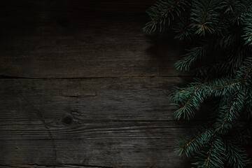 Wall Mural - Christmas green frame from fir branches on a vintage gray board back. Frame of fir branches. Christmas card blank.
