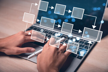 Businessman using a computer. Analysis automation with flowchart on virtual screen. Scheme of hierarchy management of corporate and processing management