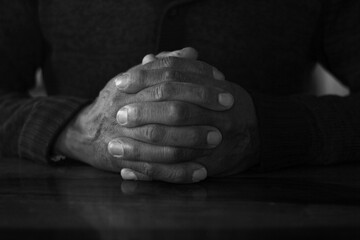 man praying hand together with grey background stock image and stock photo