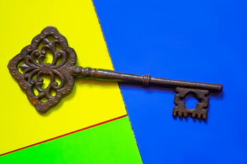 old keys on color background, close-up. Old ornate skeleton key 