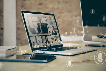 Poster - Close up of laptop on desk with glowing video conference hologram and polygonal connections on blurry office background. Remote work and online meeting concept.