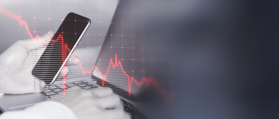 Poster - Close up of male hands using laptop and cellphone with glowing downward business chart on blurry wide perspective background with mock up place. Crisis and market recession concept. Double exposure.