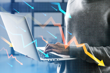 Poster - Close up of hands using laptop with downward falling arrows on blurry office interior background. Stock or financial market crash, crisis concept. Double exposure.