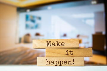Wall Mural - Wooden blocks with words 'Make it happen'.