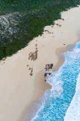 Wall Mural - Aerial top down view of beach and clear blue water. Ocean waves on the beach as a background. Beautiful natural summer vacation holidays background. Margaret River, Western Australia. Coastal seascape