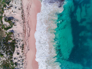 Wall Mural - Aerial view of sandy beach with waves on beach. Sunny day in summer with transparent tropical blue water. Western Australia, Australia. Top view. Coastal, Seascape