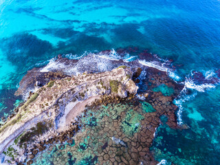 Wall Mural - Aerial view of the sea and the ocean looking down on coral reef in Western Australia.