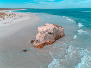 Wall Mural - Beautiful seascape view of the coastline with rock in the shallow water.