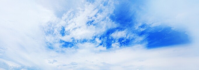 Wall Mural - White cirrus clouds blue sky background, fluffy cumulus cloud texture, beautiful cloudy skies wide panoramic view, cloudscape panorama, sunny heaven, cloudiness weather backdrop, ozone layer, overcast
