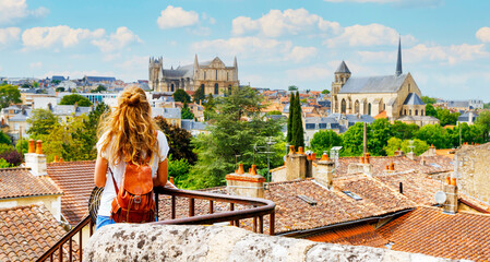 Wall Mural - poitiers city landscape viewpoint- woman tourist looking at city skyline- vacation, travel destinati