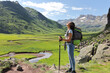 © Antonioguillem - Relaxed hiker breathing fresh air in a mountain valley