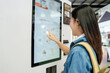© PBXStudio - Asian female tourist choosing coffee menu from vending machine