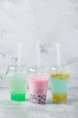 Wall Mural - Fruity Bubble Tea in glass cup on dark background