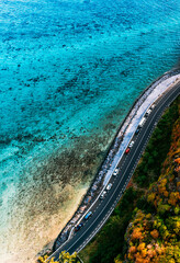Wall Mural - Beautiful aerial view of Maconde Point in Mauritius. Highway wrapping around the coastline.
