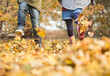 © KOTO - Children walking in autumn leaves