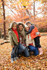 Canvas Print - Family smiling together in park