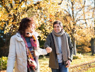 Wall Mural - Couple holding hands in park