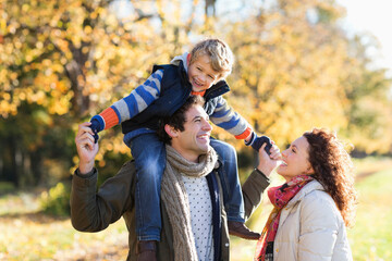 Wall Mural - Caucasian family walking in park